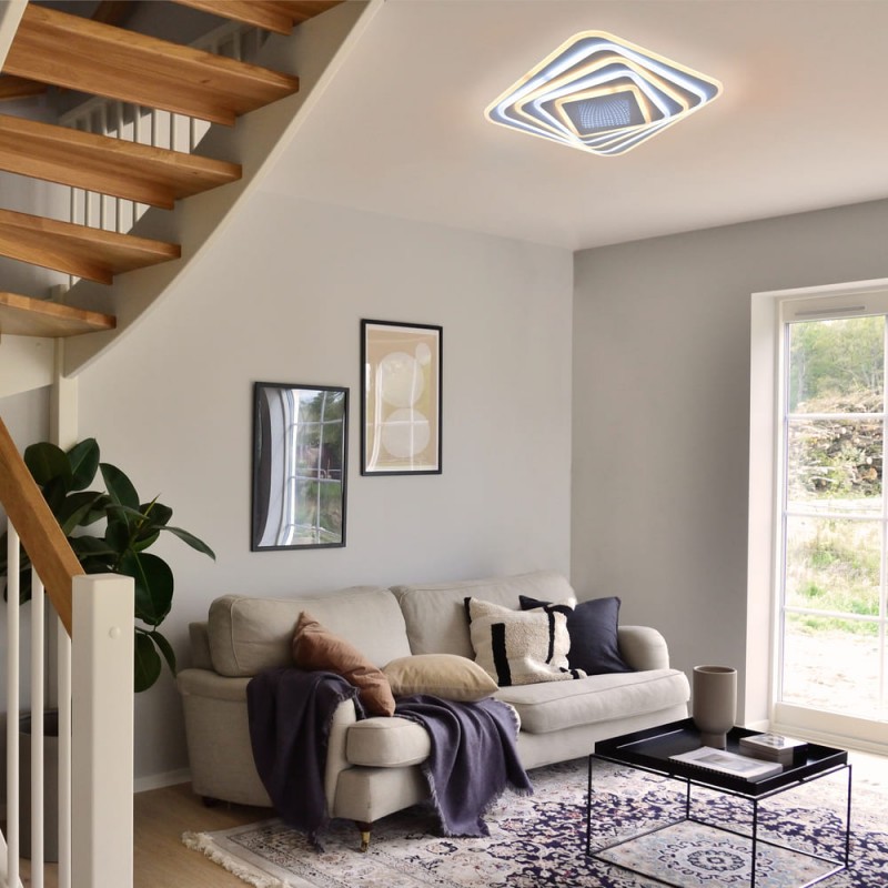 Salón decorado con Plafón Smart Mei 3D 135W 3CCT regulable encendido con luz cálida combinada