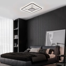 Dormitorio moderno decorado con Plafón Smart Otie 2 135W 3CCT regulable encendido en tono neutro