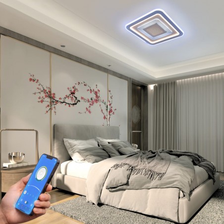 Dormitorio decorado con el Plafón Smart Otie encendido y controlado desde un móvil con iluminación combinada en tono frío