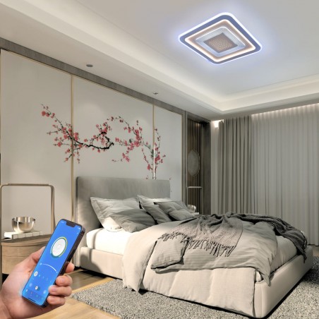 Dormitorio decorado con el Plafón Smart Otie encendido y controlado desde un móvil con iluminación combinada en tono frío