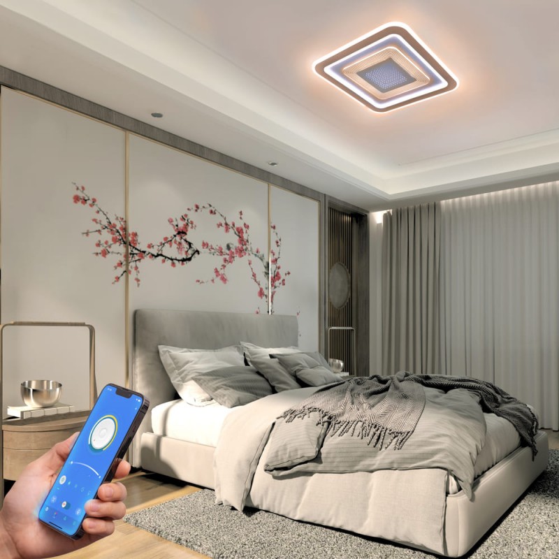 Dormitorio decorado con el Plafón Smart Otie encendido y controlado desde un móvil con iluminación combinada en tono cálido