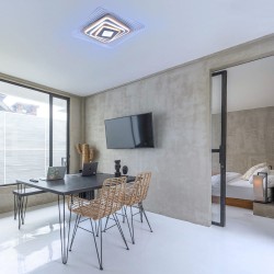 Oficina moderna decorada con el Plafón Smart Ara 70W 3CCT regulable encendido con iluminación combinada en tono de luz fría