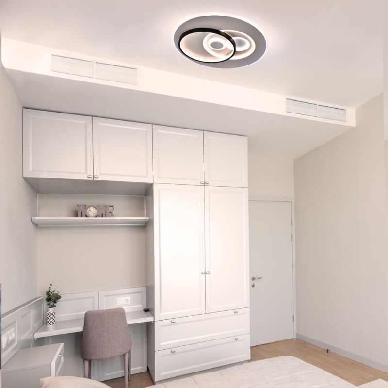 Dormitorio juvenil decorado con Plafón Smart Enyo 80W 3CCT regulable encendido con luz combinada de tono neutro