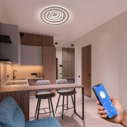 Cocina - comedor decorada con Plafón Smart Cloud encendido con iluminación combinada de tono neutro y controlado desde un móvil